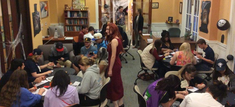 The Writing Center on Halloween, filled with students in Writing Circles and Sessions.